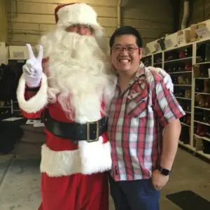 Old Bus Depot Markets Director, Anthony Niravong, with Santa. 2017