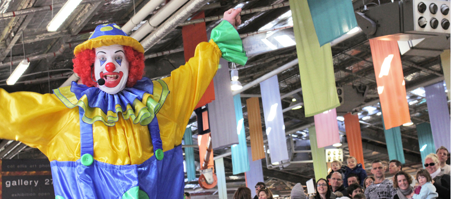 Milo the Clown performing at the Old Bus Depot Markets for their annual theme event, Kids in the Shed