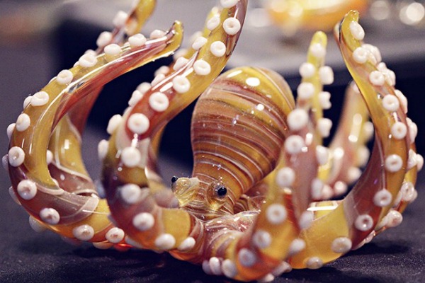 Delicate orange and yellow miniature glass octopus made by Old Bus Depot Markets stallholder, Glass Miniatures