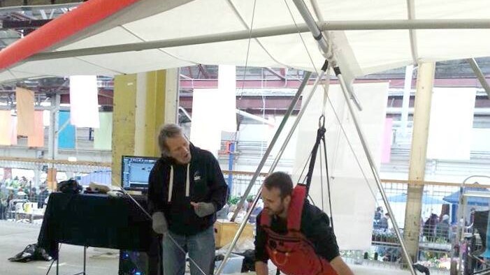 Visitors to the Old Bus Depot Markets trying the Drone Flight Academy display